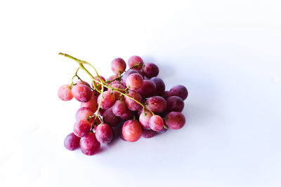 Close-up of grapes against white background