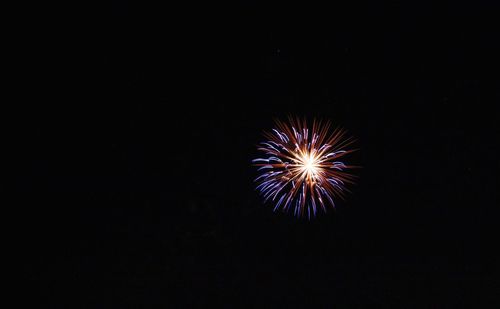 Firework display at night