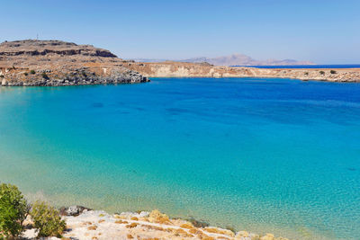 Scenic view of sea against clear blue sky