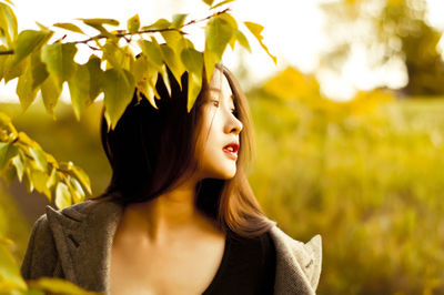 Young woman looking away outdoors