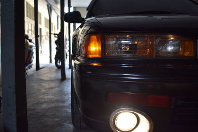 Close-up of illuminated car on street