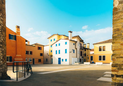 Houses in city against sky