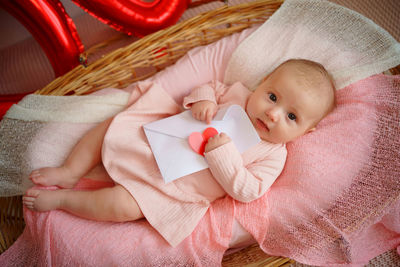 Valentine's day, little girl with valentine envelope