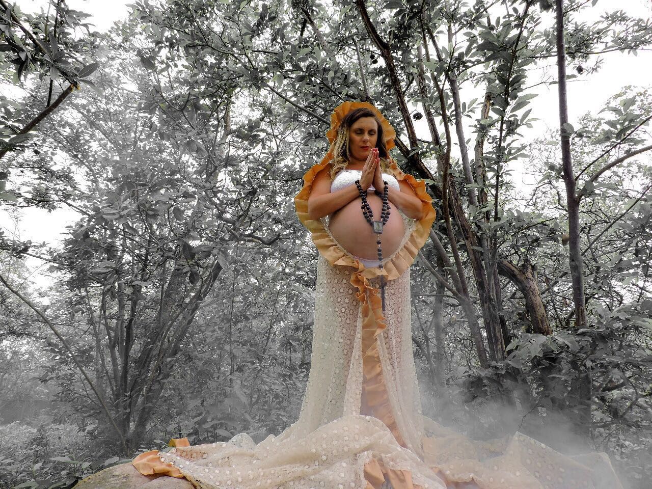 PORTRAIT OF WOMAN STANDING AGAINST BARE TREES IN FOREST