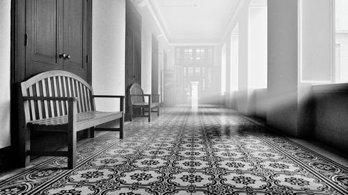 Surface level of empty benches in corridor