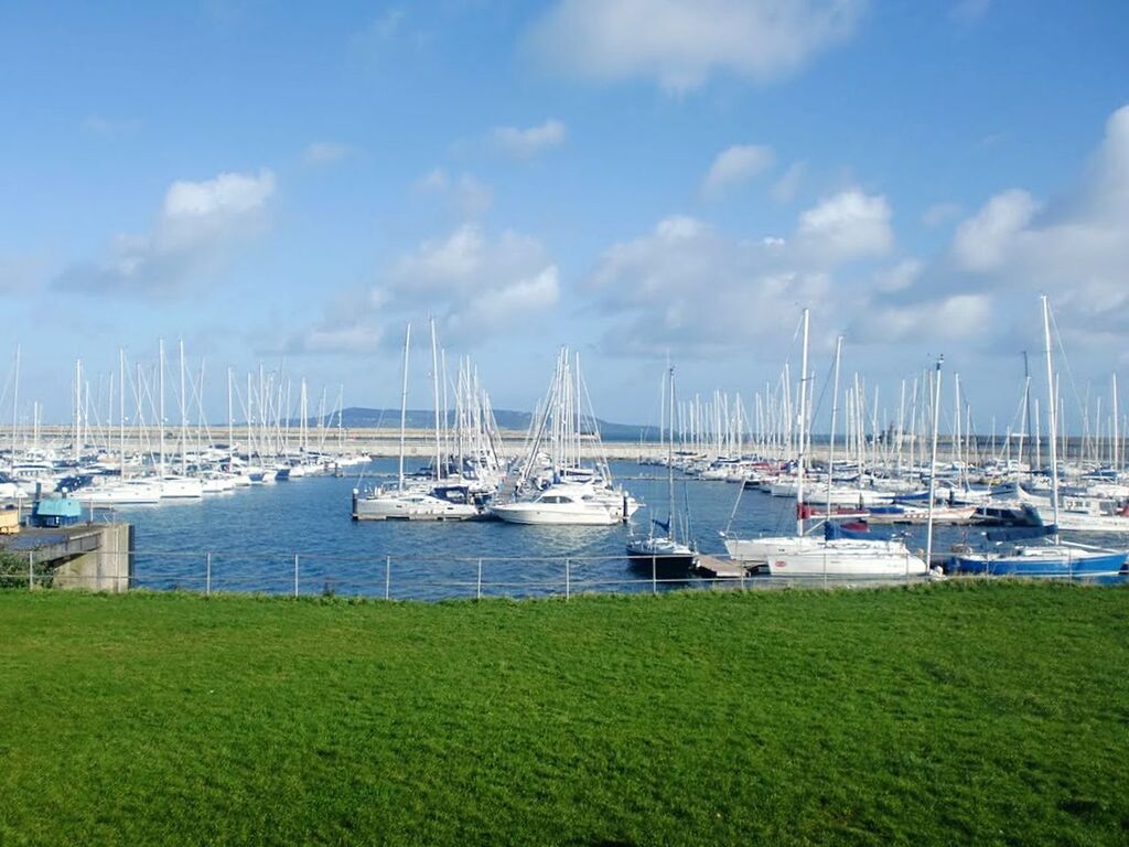 BOATS MOORED IN HARBOR