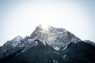 Scenic view of snowcapped mountains against clear sky