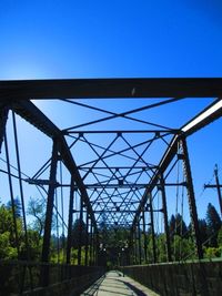 View of bridge against clear blue sky