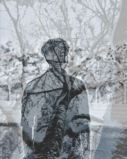 Portrait of woman with snow covered tree