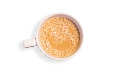 High angle view of coffee cup over white background
