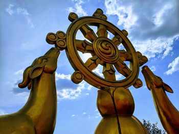 Low angle view of statue against sky