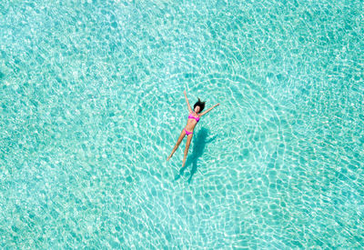 High angle view of woman swimming in pool