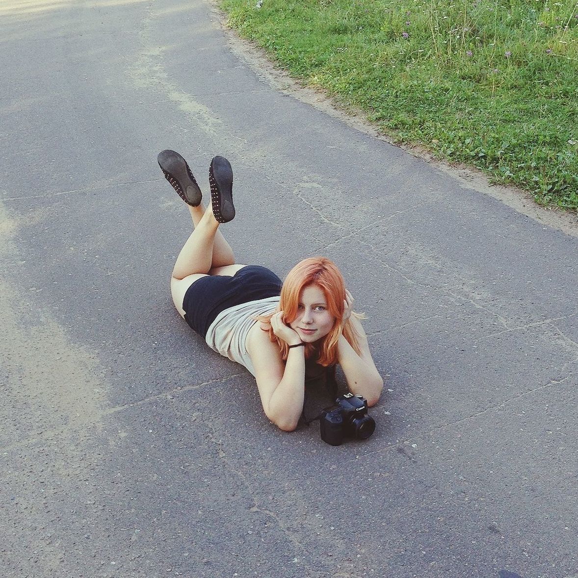 high angle view, lifestyles, leisure activity, childhood, casual clothing, full length, person, grass, togetherness, street, sitting, day, sunlight, outdoors, road, boys, fun, bonding