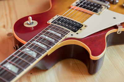 Close-up of guitar on table