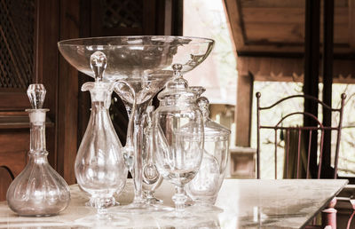 Close-up of glass containers on table at home