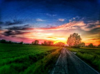 Road passing through field