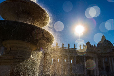 Low angle view of fountain against building