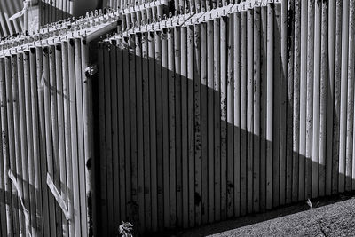Metal fence against wall