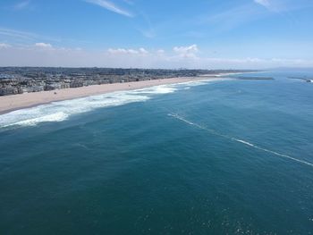 Scenic view of sea against blue sky