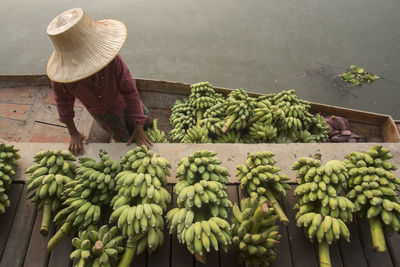 High angle view of vendor selling banana at floating market