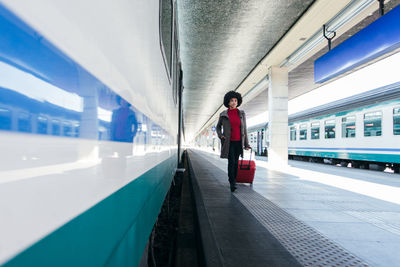 Tourist woman going for vacation trip on train