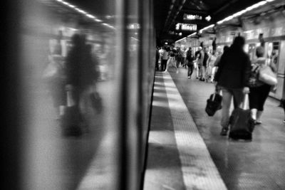 People walking on subway platform