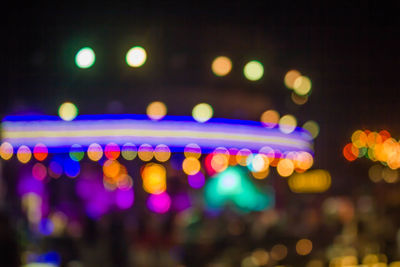 Defocused image of illuminated lights at night