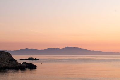 Scenic view of sea against sky at sunset