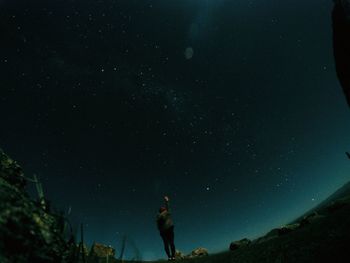 Scenic view of landscape against sky at night