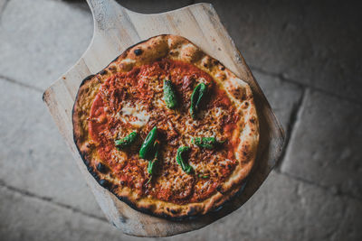 Directly above shot of pizza on cutting board