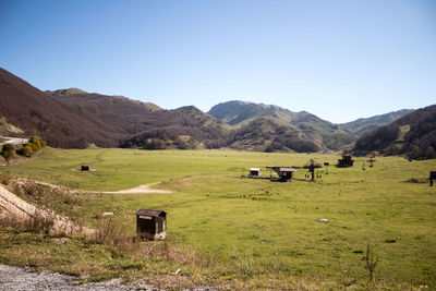 Scenic view of field against clear sky