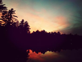 Scenic view of lake at sunset