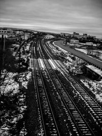 High angle view of railroad tracks in city against sky