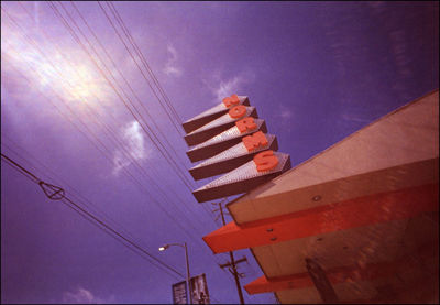 Low angle view of illuminated building against sky