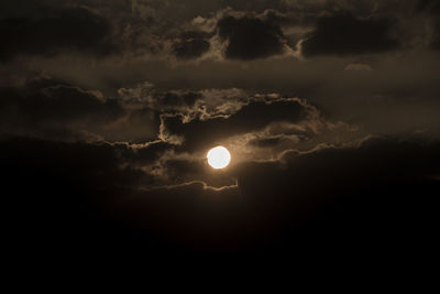 Scenic view of silhouette moon against sky during sunset