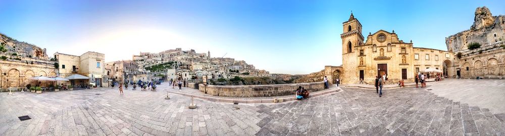 Group of people in front of buildings in town