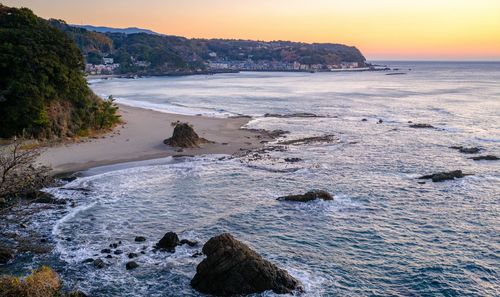 Scenic view of sea against sky during sunset