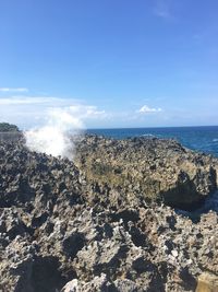 Scenic view of sea against sky on sunny day