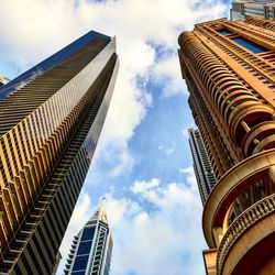 Dubai skyscrapers with clouds and blue sky in background 