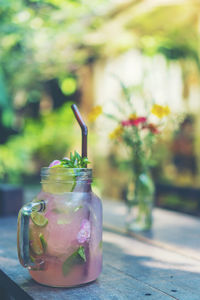 Close-up of drink in glass jar on table