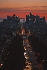 High angle view of road amidst buildings during sunset in city