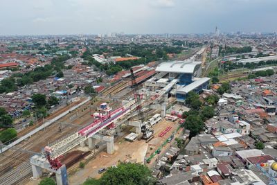 High angle view of rail way amidst buildings in city of jakarta