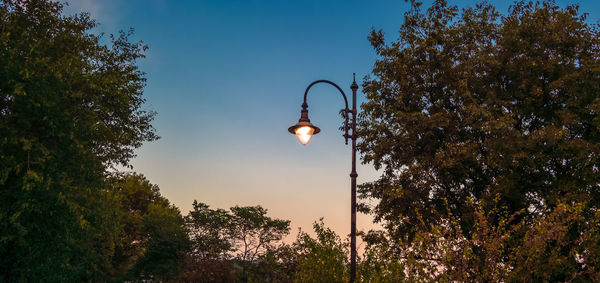 Low angle view of light bulb against sky