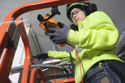 Engineer working with multimeter