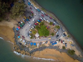 Aerial view of cars on road at beach