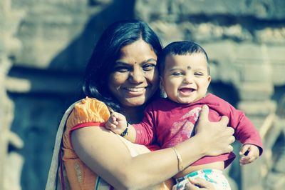 Portrait of mother and son outdoors