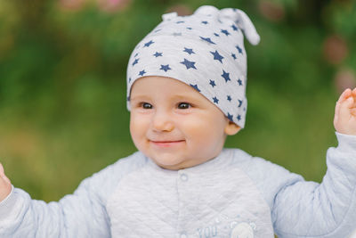 Charming boy in a summer park