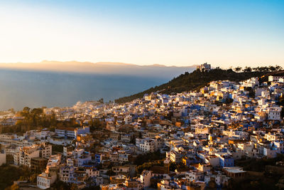 Rays of setting sun over the medina of chefchaouen, morocco.