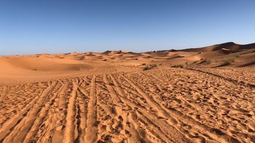 Scenic view of desert against clear sky