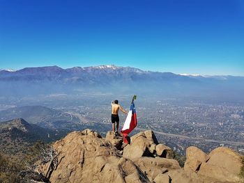 High angle view of man standing on mountain